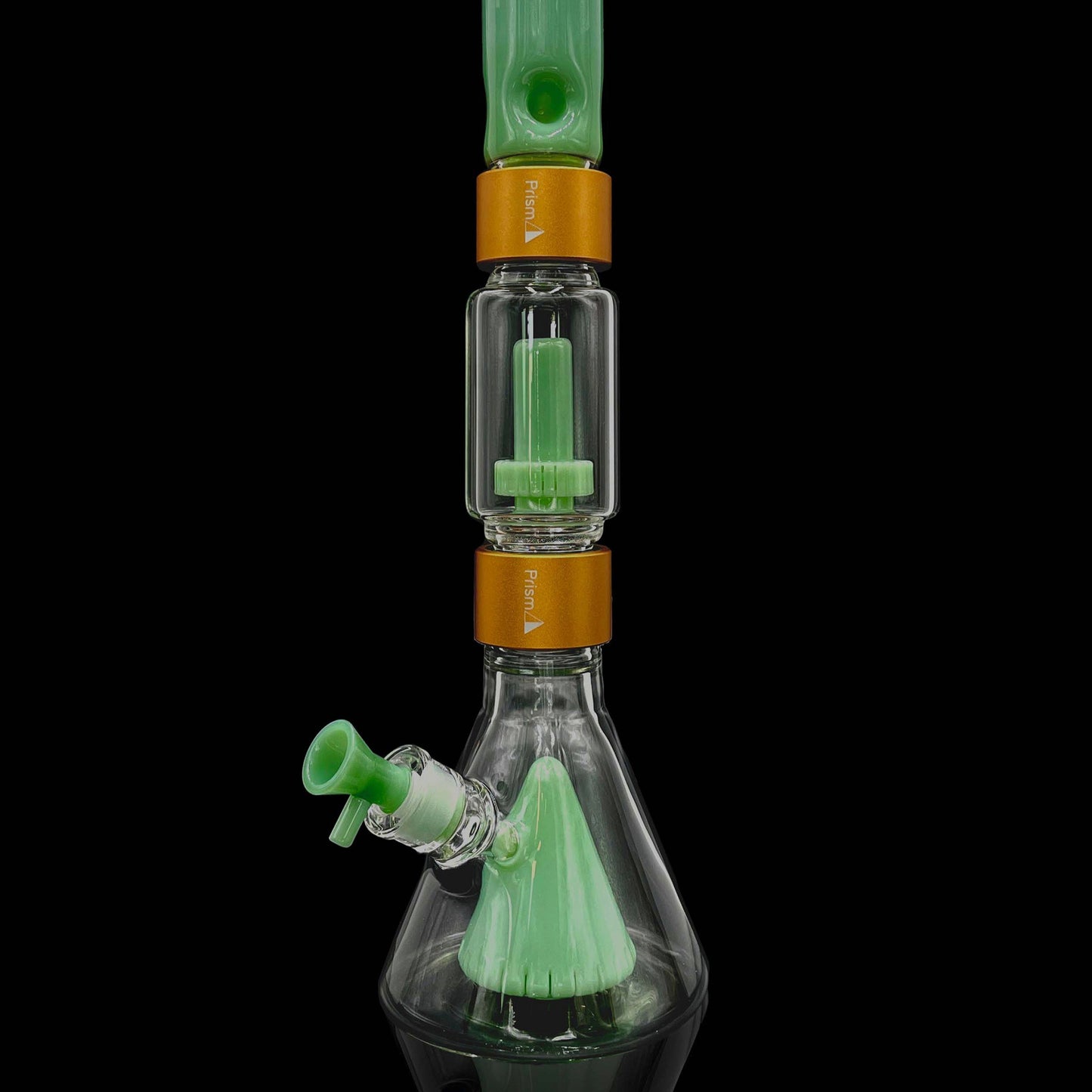 Glass smoking device with green and orange accents on a black background
